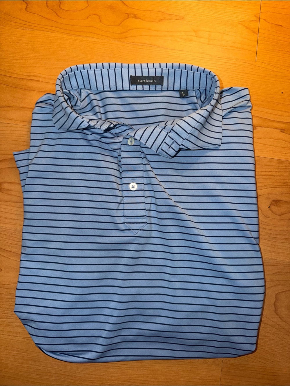 Turtleson Men's Light Blue Stripe Performance Polo small stain
